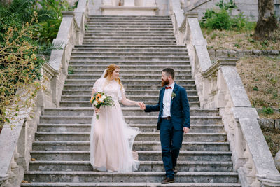 Friends standing on staircase