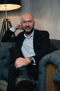 Portrait of businessman sitting on sofa