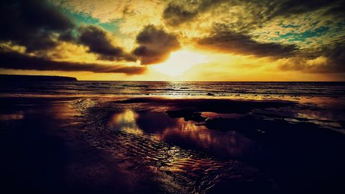 Scenic view of sea against dramatic sky