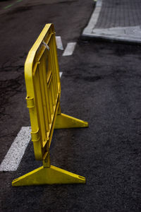 High angle view of yellow umbrella on street