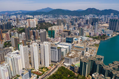 High angle view of modern buildings in city against sky