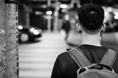 Rear view of man in city street