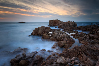 Scenic view of sea against sky during sunset