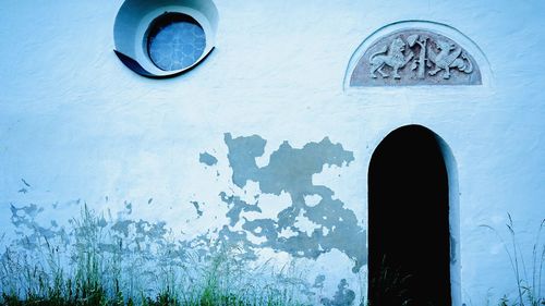 Low angle view of old building against blue sky