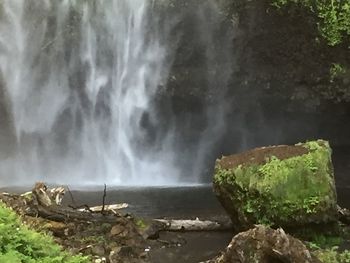 Close-up of waterfall against rocks
