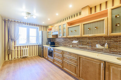 Interior apartment kitchen and dining room, refectory area cooking equipment, table furniture stove