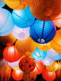 Low angle view of illuminated lanterns hanging on ceiling