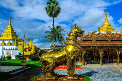 Statue of temple against building