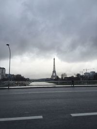 City street against cloudy sky