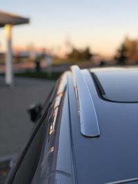 Close-up of car on street against sky