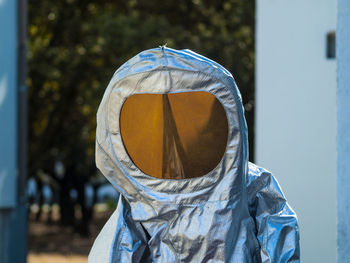 Person in protective workwear standing outdoors