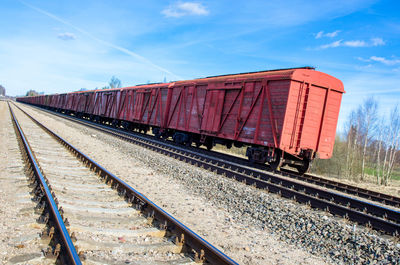 Freight train against sky