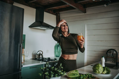 Full length of woman standing at home