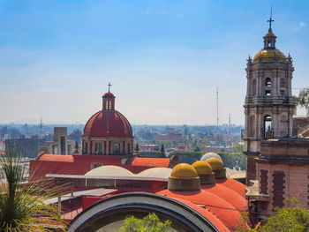 View of buildings against sky in city