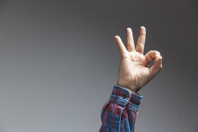 Midsection of person hand against black background