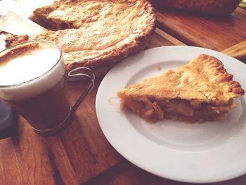 Slice of apple pie and cup of coffee