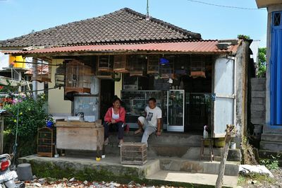 View of houses against blue sky