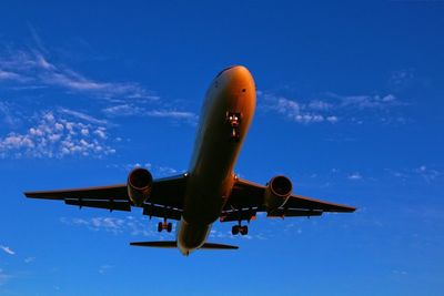 Low angle view of airplane against sky