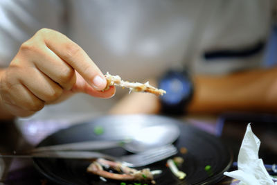 Midsection of man having food