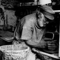 Close-up of man working with clay indoors