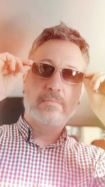 Close-up portrait of man wearing sunglasses
