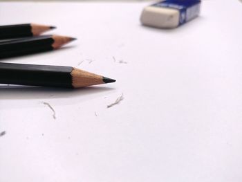 High angle view of pencils on white background