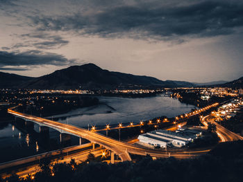 High angle view of illuminated road against sky at night