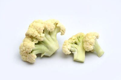 Close-up of fresh vegetables against white background