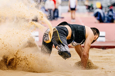 Athlete suffering from amputee long jumping