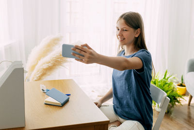 Young woman using mobile phone