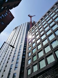 Low angle view of modern buildings against sky
