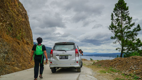 People on car against sky