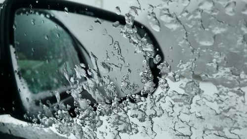 Close-up of water drops on glass window