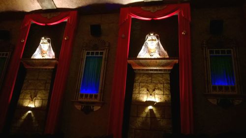 Low angle view of illuminated lanterns in darkroom