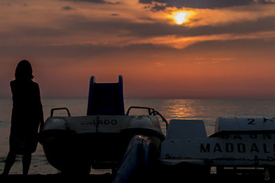 Silhouette of pier at sunset