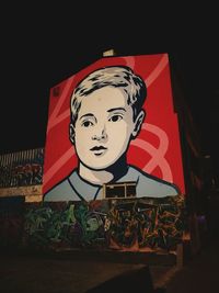 Portrait of man with red umbrella