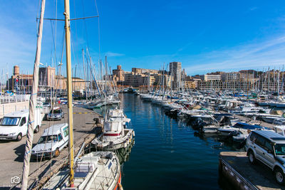 Boats moored at harbor