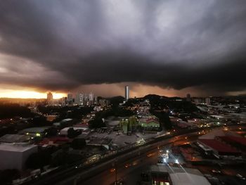 High angle view of illuminated city buildings against sky