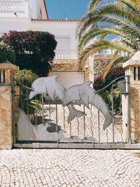 View of an animal sculpture on palm tree