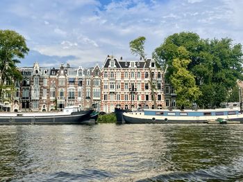 Boats in sea against sky