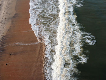 Close-up of water flowing at beach