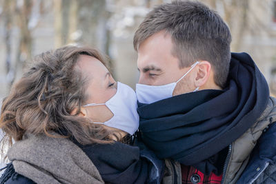 Portrait of couple kissing in winter
