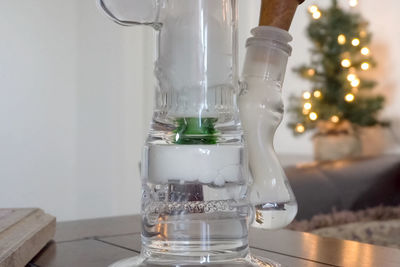 Close-up of glass bottle on table