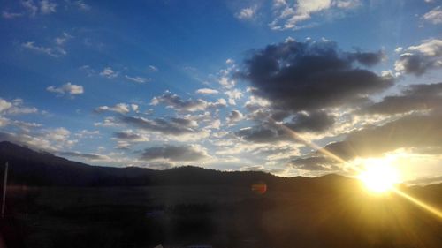 Scenic view of silhouette mountains against sky during sunset