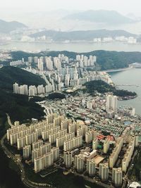 High angle view of buildings in city against sky
