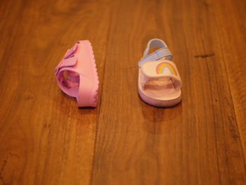 High angle view of shoes on wooden table