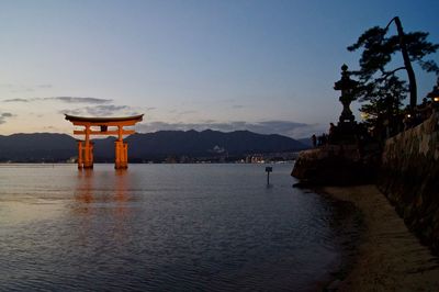The torii gate at miyajima, japan at dusk.