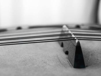 Close-up of guitar on table