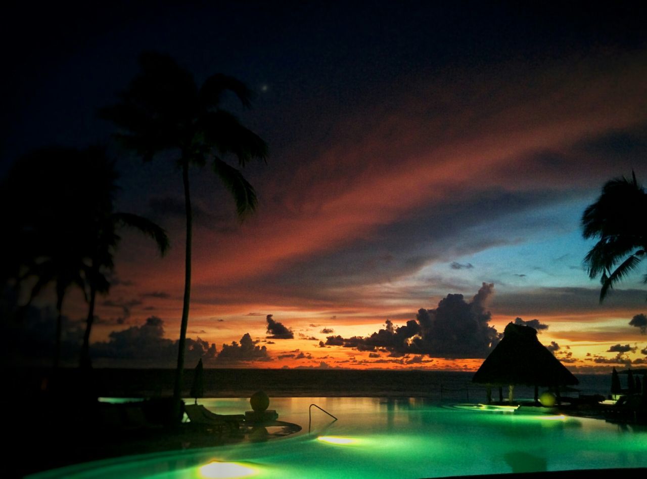 palm tree, sunset, tree, sky, water, scenics, beauty in nature, tranquil scene, tranquility, cloud - sky, silhouette, nature, dusk, idyllic, orange color, dramatic sky, sea, cloud, no people, outdoors