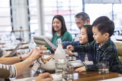 Family eating food in restaurant